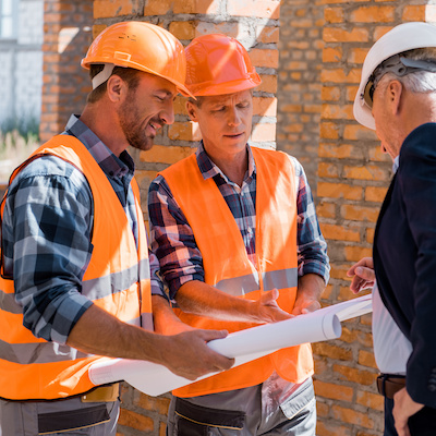 construction workers discussing plans
